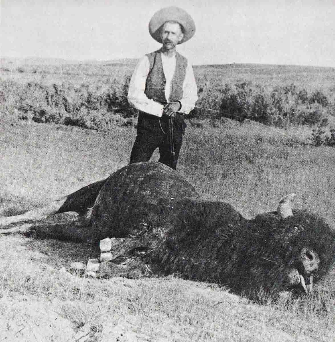 L.A. Huffman and buffalo taken with the .44 Henry saddle gun. Photo credit University of Montana Archives.